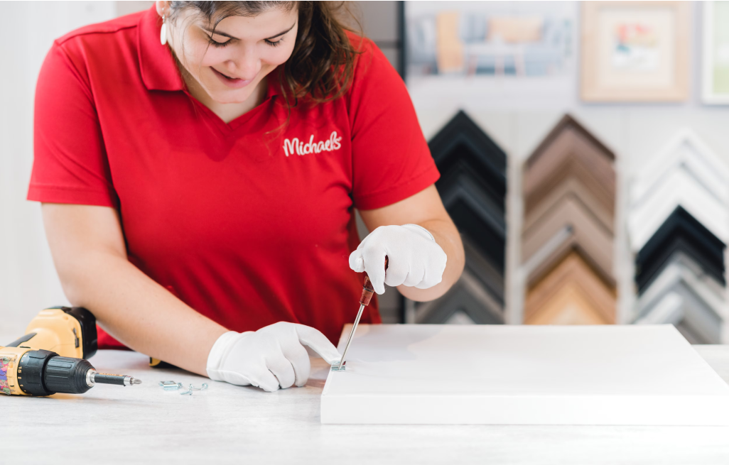 Designer assisting customer with custom frame options in-store